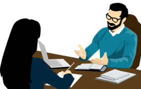 Man och kvinna i möte med datorer.