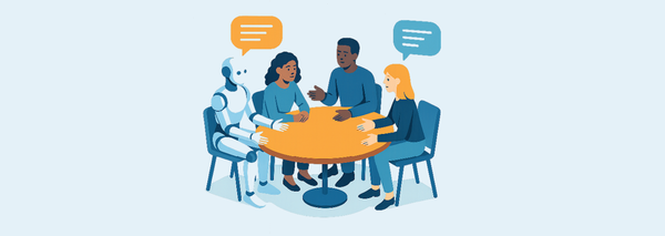 Fyra personer och en robot sitter runt ett bord och samtalar.