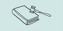 En lovbok og en dommerhammer. Illustrasjon