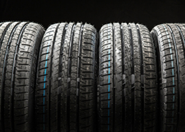 4 tyres with black background. Photo: Mostphotos