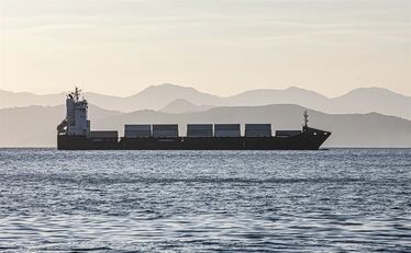 cargo-ship-on-the-background-of-blurred-mountains Photo: BORIS FEDORENKO