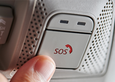 Pushing sos button in car. Photo: Adobe Stock