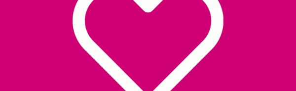 Ett vitt hjärta mot rosa bakgrund